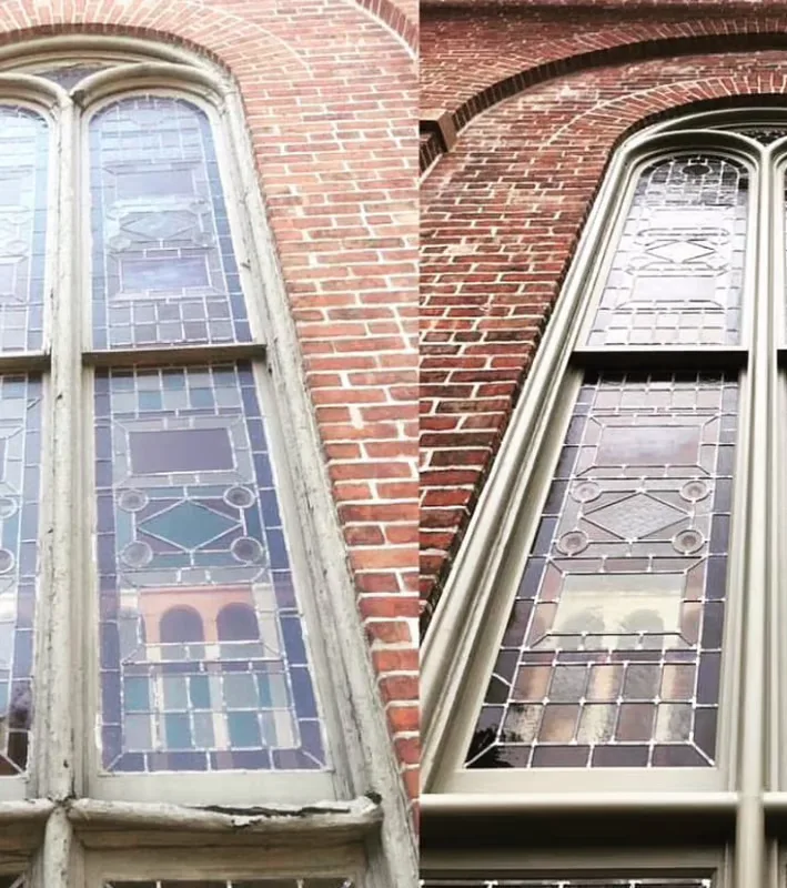 HM Historical Conservation artisans restoring a leaded glass panel in the Newark workshop